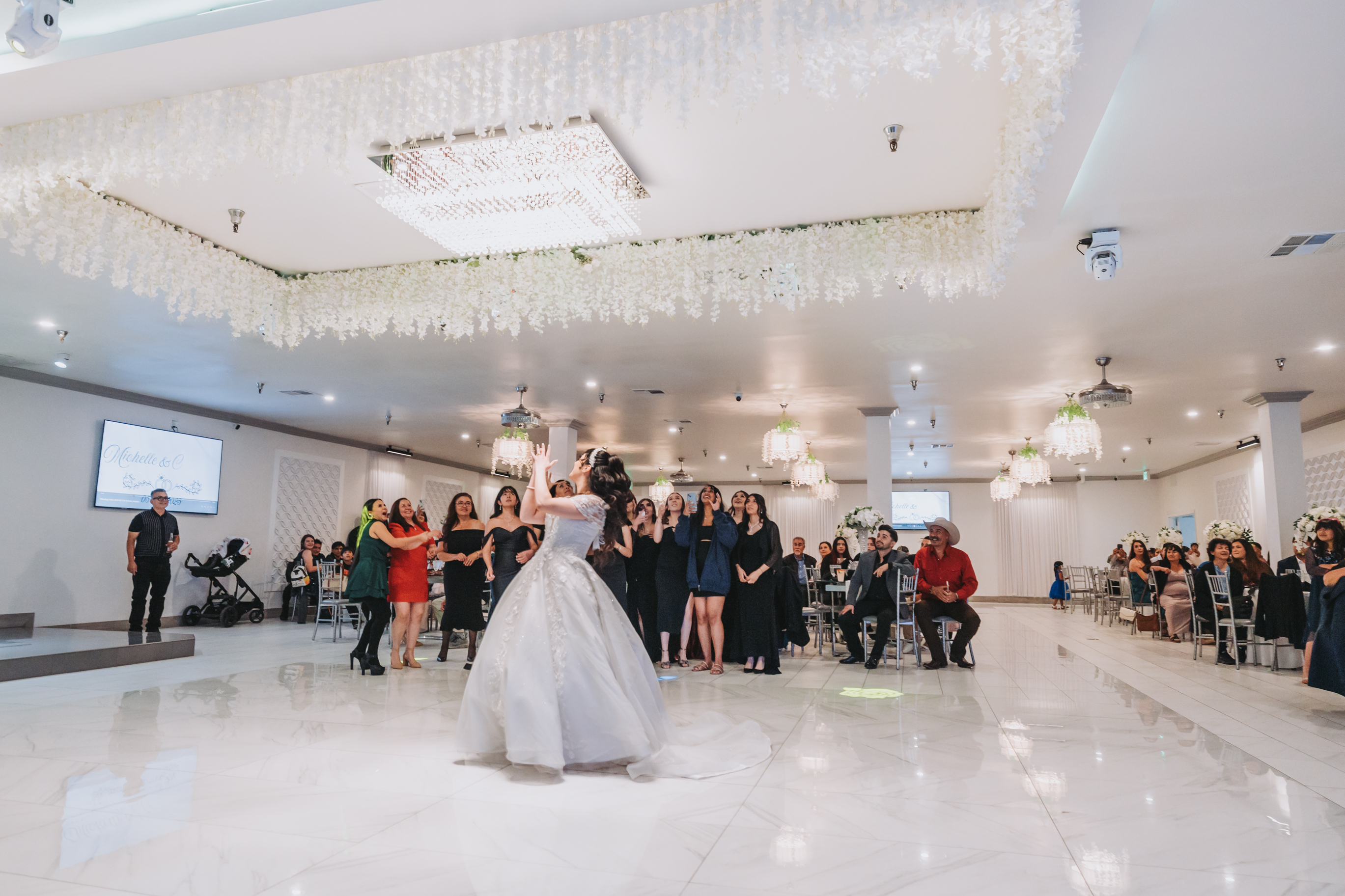 Bride bouquet toss at Vive Banquet Hall wedding